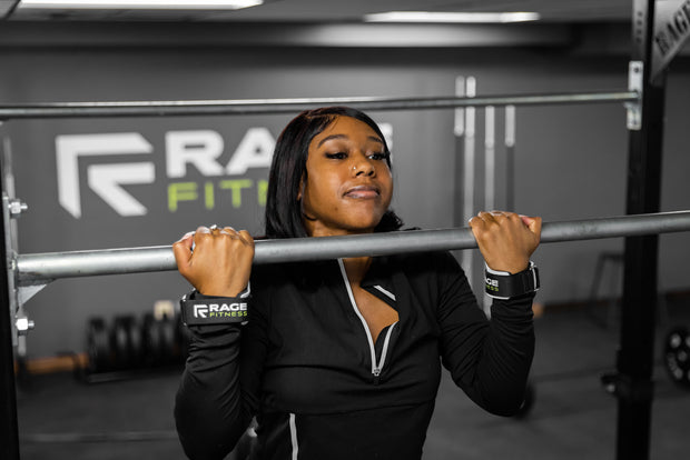 Woman doing chin-up with RAGE Fitness Lift Grips on her hands
