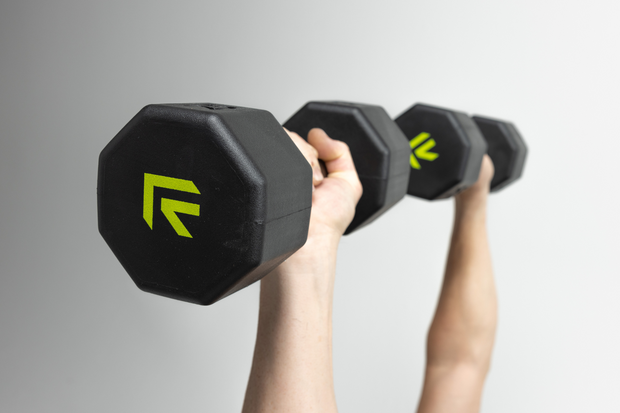 Hands lifting set of octo dumbbells by Rage Fitness