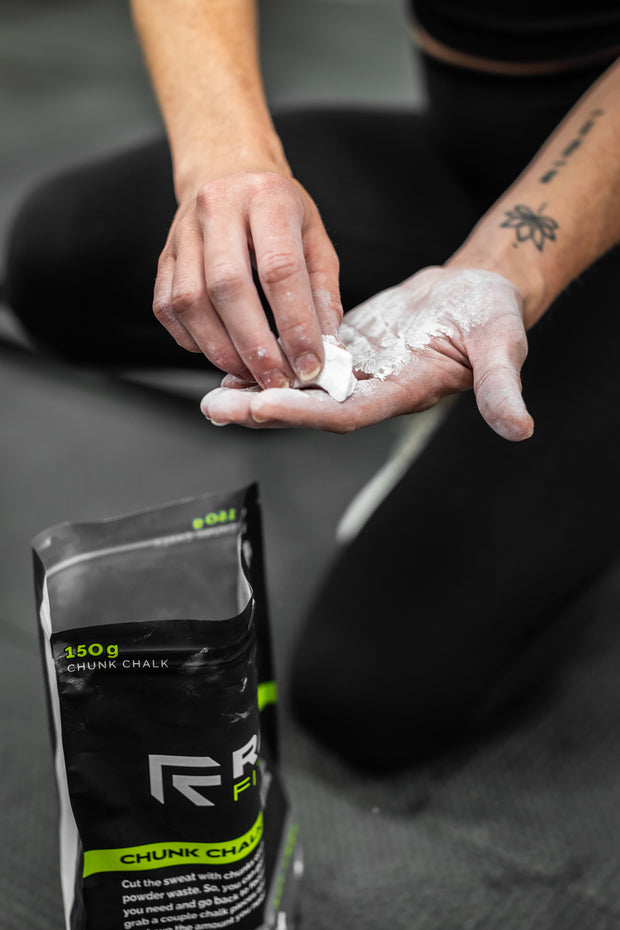 Athlete rubbing RAGE Fitness Chunk Chalk on their hands