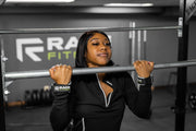 Woman doing chin-up with RAGE Fitness Lift Grips on her hands